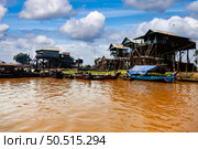Houses on Stilts Line Tonle Sap Lake in Cambodia. Стоковое фото, фотограф Aleksandr Golubev / Фотобанк Лори