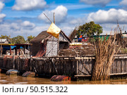 Floating House With Fishing Equipment on Tonle Sap Lake in Cambodia. Стоковое фото, фотограф Aleksandr Golubev / Фотобанк Лори