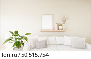 The living room is decorated with chairs, sofaand picture frames. Стоковое фото, агентство Ingram Publishing / Фотобанк Лори