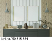 The study room is decorated with a table, picture frames, lamps and small potted plants. Стоковое фото, агентство Ingram Publishing / Фотобанк Лори