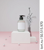 Pump bottle for cream or perfume on pink background. Стоковое фото, агентство Ingram Publishing / Фотобанк Лори