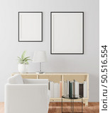 The living room is decorated with chairs, sofaand picture frames. Стоковое фото, агентство Ingram Publishing / Фотобанк Лори
