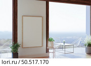 Picture frames with plant pots adorn the living room. Стоковое фото, агентство Ingram Publishing / Фотобанк Лори