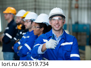 Group of emotional engineers who take pleasure in the achievement of the responsible project’s work. Стоковое фото, агентство Ingram Publishing / Фотобанк Лори