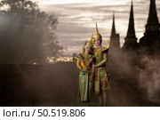Khon, Is a classical Thai dance in mask. Except for these two characters who weren’t wearing masks. because these are the main actor and actress of the story. Стоковое фото, агентство Ingram Publishing / Фотобанк Лори
