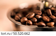 Coffee grains of coffe grinder, close-up. Стоковое фото, агентство Ingram Publishing / Фотобанк Лори