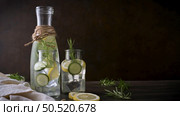 Water flavored with lemon, cucumber and rosemary leaves. Стоковое фото, агентство Ingram Publishing / Фотобанк Лори