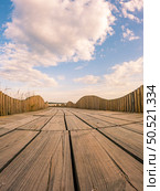 View from the walkway south of Furadouro beach in Ovar on a stormy day at sunset. Стоковое фото, агентство Ingram Publishing / Фотобанк Лори