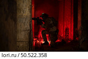 Soldier in anti-terrorist warfare in a dark building, Anti-terrorist operation training on the battlefield. Стоковое фото, агентство Ingram Publishing / Фотобанк Лори
