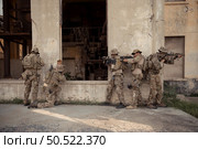 Professional marine soldiers training with weapon on a military range. Стоковое фото, агентство Ingram Publishing / Фотобанк Лори