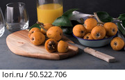 loquats on kitchen counter background. Стоковое фото, агентство Ingram Publishing / Фотобанк Лори