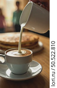 Milk spilling from jar to cup of coffee early summer or spring morning. Стоковое AI-видео, аниматор Sergey Grishin / Фотобанк Лори