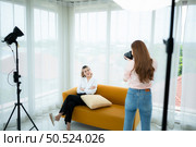 Beautiful asian woman Vlogger and blogger recording video for social media content live streaming at home. Стоковое фото, агентство Ingram Publishing / Фотобанк Лори