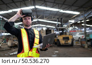Engineer and mechanical system placement in the old mechanical factory by using a virtual reality simulator design to achieve the most efficient and accurate. Стоковое фото, агентство Ingram Publishing / Фотобанк Лори
