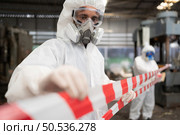 Restricted area, officials employ white and red stripes to block the area where a chemical leak is occurring. To prevent individuals from coming into contact with potentially dangerous chemicals, Стоковое фото, агентство Ingram Publishing / Фотобанк Лори