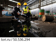 Scientists and government officials Inspect and collect chemical leak samples in industrial sites. to be thoroughly investigated in the laboratory. Стоковое фото, агентство Ingram Publishing / Фотобанк Лори