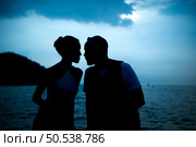 Happy moments of interracial couples on a yacht The couple had their honeymoon at one of Asia’s most beautiful seas. Стоковое фото, агентство Ingram Publishing / Фотобанк Лори