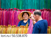 Processing of flax trees into different colors to be weaved into mats. One of the occupations and lifestyles of village people in rural Thailand. Стоковое фото, агентство Ingram Publishing / Фотобанк Лори
