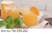 Fresh organic orange juice. Homemade citrus orange juice in glasses on table. Стоковое фото, агентство Ingram Publishing / Фотобанк Лори