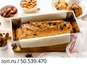 Fruitcake with cranberry, almond and pecan nuts in baking form. Стоковое фото, агентство Ingram Publishing / Фотобанк Лори