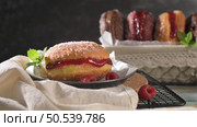 Bolas de Berlim, or "Berlin Balls". Portuguese fried dough with sugar, Filled with sweet cream. Стоковое фото, агентство Ingram Publishing / Фотобанк Лори