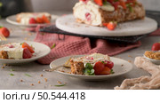 Meringue roll cake with cream, raspberries. Roulade, summer dessert served in ceramic plate. Стоковое фото, агентство Ingram Publishing / Фотобанк Лори
