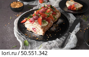 Meringue roll cake with cream, raspberries. Roulade, summer dessert served in ceramic plate. Стоковое фото, агентство Ingram Publishing / Фотобанк Лори