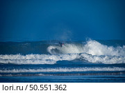 Bodyboarder surfing ocean wave on a sunny winter day. Стоковое фото, агентство Ingram Publishing / Фотобанк Лори