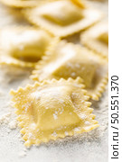 Cooking ravioli on a floured kitchen table. Стоковое фото, агентство Ingram Publishing / Фотобанк Лори