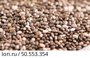 Superfoods on a gray background with copy space. Nuts, beans, greens and seeds. Healthy vegan food. Стоковое фото, агентство Ingram Publishing / Фотобанк Лори