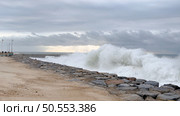 OVAR, PORTUGAL - 31 OCTOBER 2023: The sea rises to the seafront of Furadouro in Ovar. The advance of the sea due to climate change threatens Portugal. Стоковое фото, агентство Ingram Publishing / Фотобанк Лори