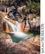 Cascata do Tahiti is also known as Fecha das Barjas and is a waterfall with several natural pools where you can swim. It is located in the Peneda Geres National Park in the north of Portugal. Стоковое фото, агентство Ingram Publishing / Фотобанк Лори