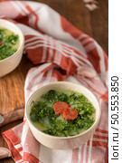 Caldo verde popular soup in Portuguese cuisine. traditional ingredients for caldo verde are potatoes, collard greens , olive oil and salt. Additionally garlic or onion may be added. Стоковое фото, агентство Ingram Publishing / Фотобанк Лори