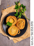 Pastries filled with meat, traditionally baked in black clay molds both from the region on Vila Real, Portugal. Стоковое фото, агентство Ingram Publishing / Фотобанк Лори