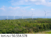 Wind turbines generating electricity on the hill in the countryside of Thailand. Стоковое фото, агентство Ingram Publishing / Фотобанк Лори