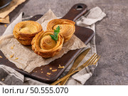 Pastries filled with meat, traditionally baked in black clay molds both from the region on Vila Real, Portugal. Стоковое фото, агентство Ingram Publishing / Фотобанк Лори
