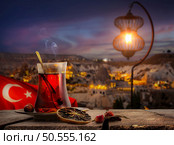 View of Cappadocia and a cup of Turkish tea. Tea drinking in Turkey. Стоковое фото, агентство Ingram Publishing / Фотобанк Лори