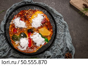 Bolo Rei or Kings Cake is a traditional Xmas cake with fruits raisins nut and icing on kitcthen countertop. Is made for Christmas, Carnavale or Mardi Gras. Стоковое фото, агентство Ingram Publishing / Фотобанк Лори