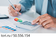 Businessman Summary report plan finance with calculate about cost at table office office. Стоковое фото, агентство Ingram Publishing / Фотобанк Лори