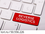 Reverse logistics - type of supply chain management that moves goods from customers back to the sellers or manufacturers, text button on keyboard. Стоковое фото, агентство Ingram Publishing / Фотобанк Лори