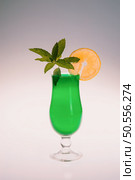 Drinks, Green, Cocktail with mint and orange slice White Background. Стоковое фото, агентство Ingram Publishing / Фотобанк Лори