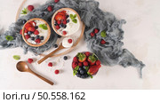 Yogurt with Chia seeds and fresh Strawberries, Raspberries, and Blueberries. Concept of Healthy Eating. Стоковое фото, агентство Ingram Publishing / Фотобанк Лори