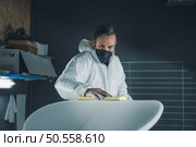 Surfboard manufacturing, Shaper working on board details. Concept of industrial manufacturing, qualified professional, occupation and employment. Стоковое фото, агентство Ingram Publishing / Фотобанк Лори