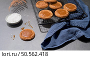 Caramel cookies flowing out of the oven, in the kitchen after baking. Стоковое фото, агентство Ingram Publishing / Фотобанк Лори