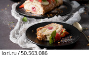 Meringue roll cake with cream, raspberries. Roulade, summer dessert served in ceramic plate. Стоковое фото, агентство Ingram Publishing / Фотобанк Лори