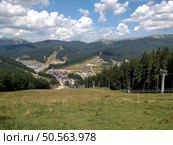 Chairlift ski lift in Bukovel Carpathians mountains Ukraine cableway extreme sport recreation concept cable car horizontal. Стоковое фото, агентство Ingram Publishing / Фотобанк Лори