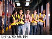 Portrait of group employees in the warehouse with arms crossed. Стоковое фото, агентство Ingram Publishing / Фотобанк Лори
