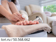 Customer’s feet after cleaning before the manicurist used cutting tools polish and paints customer’s toenails. Стоковое фото, агентство Ingram Publishing / Фотобанк Лори