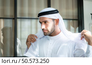 Portrait of a handsome young Arabic man in traditional clothes. Стоковое фото, агентство Ingram Publishing / Фотобанк Лори
