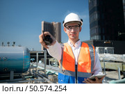 Engineers inspect the completed air conditioning and water systems to continue verifying their functionality. Стоковое фото, агентство Ingram Publishing / Фотобанк Лори